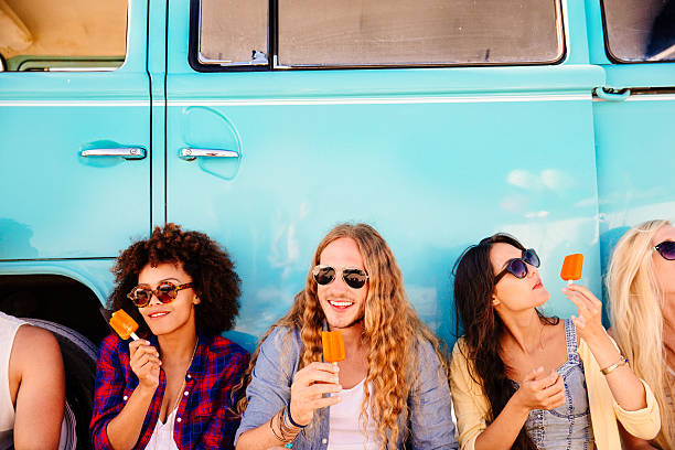 Hipster eating icecream Hipster eating icecream flavored ice photos stock pictures, royalty-free photos & images