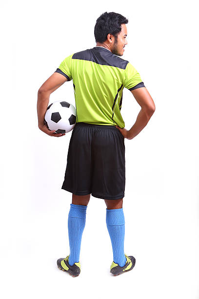 istock Young soccer football player on white 485114279