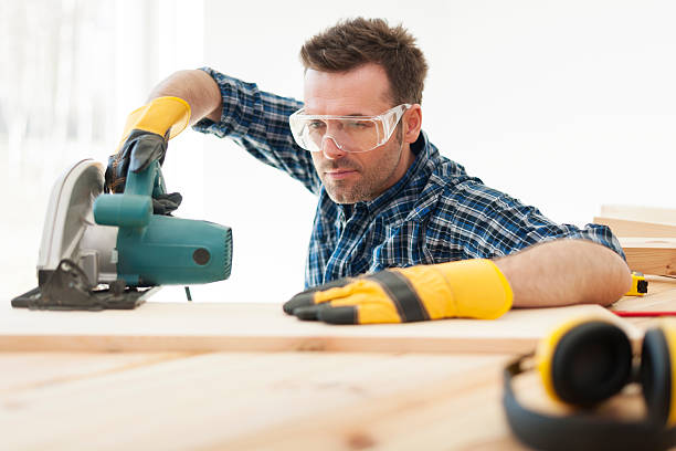 istock Focus carpenter cutting wooden plank 485116581