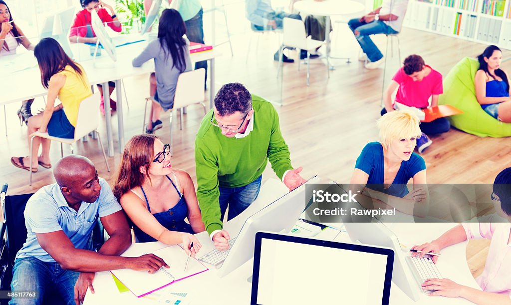 Group of Students With a Professor Teaching Group of students with a professor teaching. Adult Stock Photo