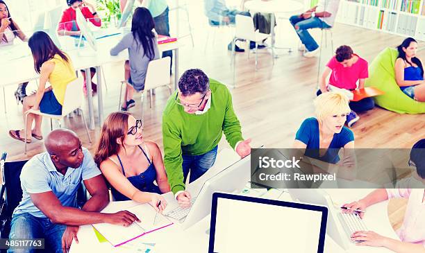 Group Of Students With A Professor Teaching Stock Photo - Download Image Now - Adult, Campus, Classroom