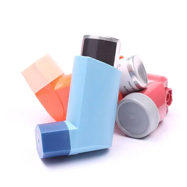 Photo of Asthma inhalers isolated over white