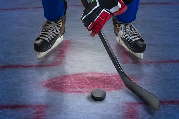 istock Legs of hockey player. 485118597