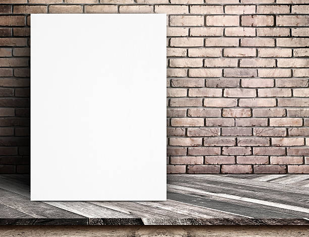 istock Black White paper poster lean at red brick wall 485118736