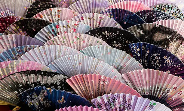 These fans are available for purchase along Gojo-zaka, the main approach to the Kiyomizu-dera Buddhist temple. the latter is located in the Higayshiyama district of Kyoto.