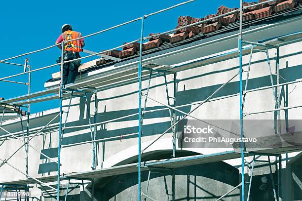 Worker Protecting Wall With Flashing In California Stock Photo - Download Image Now - Office Building Exterior, 2015, Adult