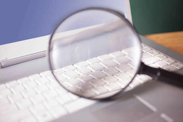 istock Business concepts. Magnifying glass on laptop computer keyboard. 485123954