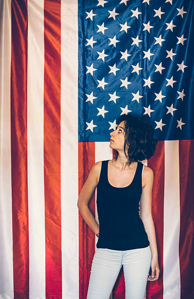 istock Girl posing in front of USA flag 485124444