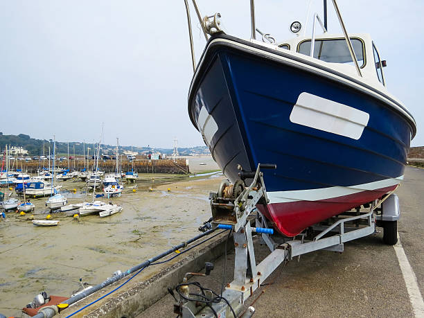 istock Sailoat on a trailer in harbor 485124626