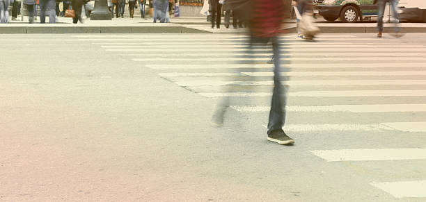 istock people leg walking on sidewalk in blur 485124766