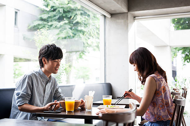 istock Young asian couple having lunch 485124980