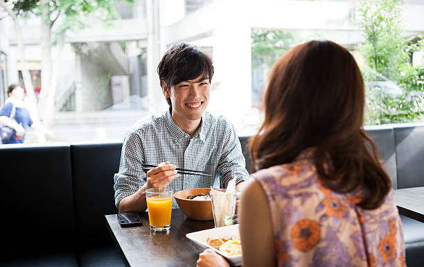 istock Handsome asian guy having lunch with a girl 485124986