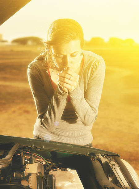 istock Young woman, stranded by car breakdown, worries as sun sets 485125036