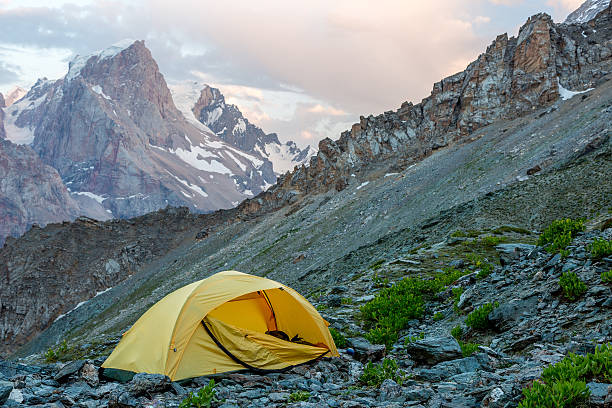 istock Yellow tent on mountain landscape 485125040