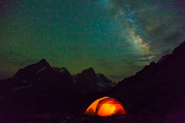 istock Night mountain landscape with illuminated tent 485130240