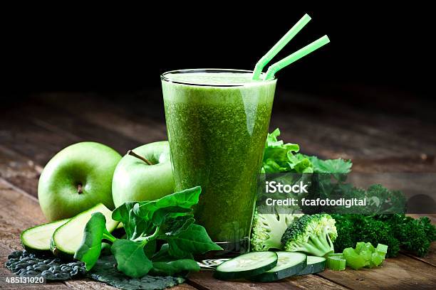 Green Vegetable Juice On Rustic Wood Table Stock Photo - Download Image Now - Smoothie, Green Color, Juice - Drink