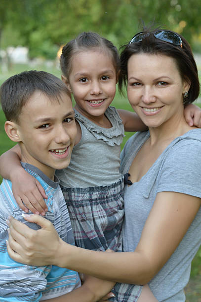 istock Mother with kids  in park 485131434