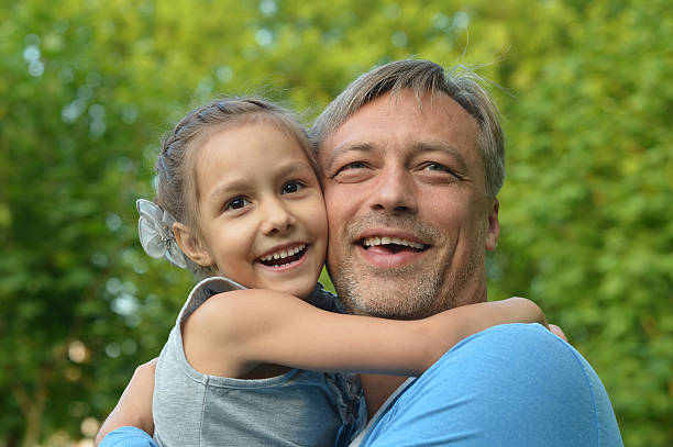 istock Father with daughter in summer park 485134386
