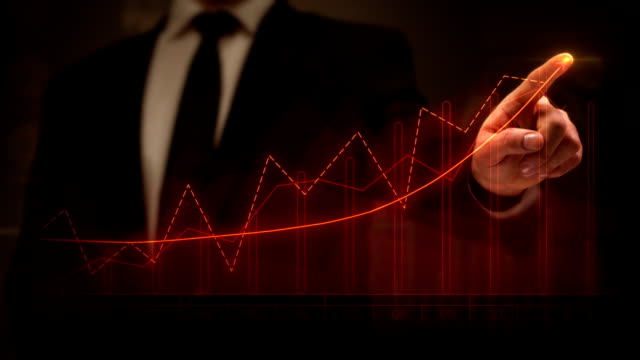 Businessman drawing an ascending financial chart. Touchscreen. Business success. Red-blue.