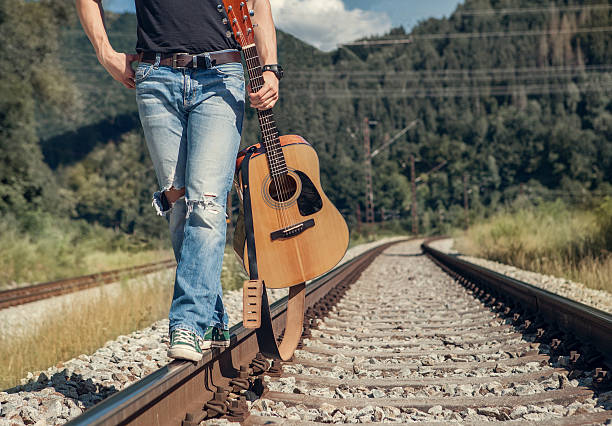 istock Close up image man legs walk on the railway 485134766