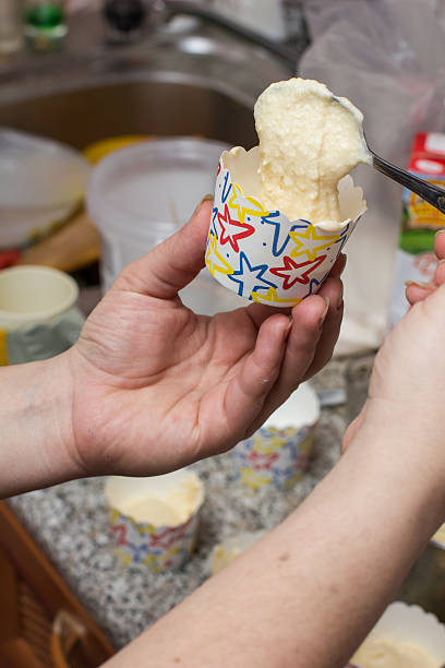 istock the girl is preparing cupcakes in the kitchen 485138514