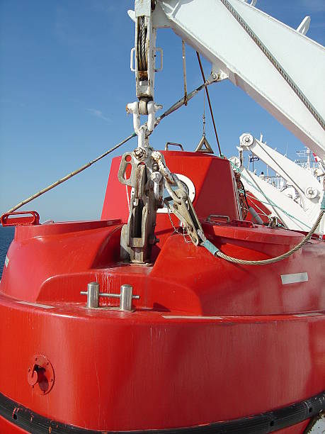 istock Red life boat on a passenger ship 485145652