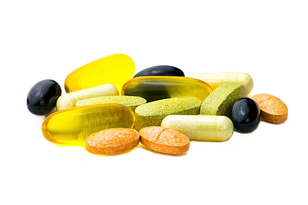 istock Mixed food supplement pills close-up, omega3, carotine, vitamins 485150010