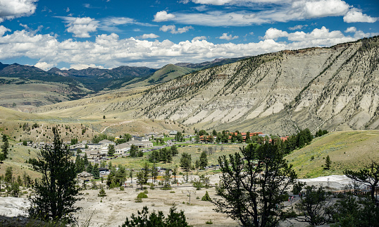 Yellowstone National Park, Wyoming, USA- July 13, 2015:  The Mammoth Hot Springs area is down below in the valley and includes a hotel, store, gas station and visitor's center.