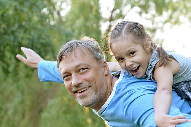 istock Father with daughter in summer park 485152256