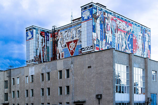 Russian Soviet Mural on Building Ufa, Russia - July 16, 2014: Old soviet era building mural in color created on the side of a block style building friedrich engels stock pictures, royalty-free photos & images