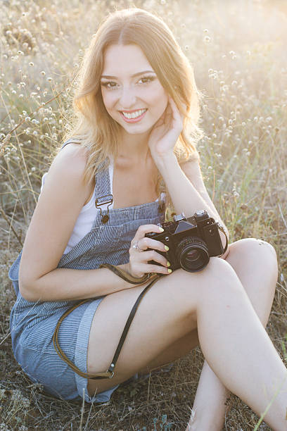 istock Happy girl making pictures by old camera 485154830