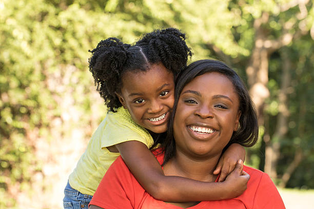 istock Mother laughing and hugging her daughter 485154862