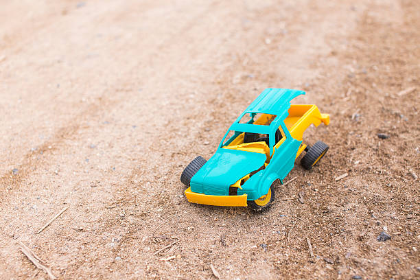 crashed toy car broken toy car on the road broken toy stock pictures, royalty-free photos & images