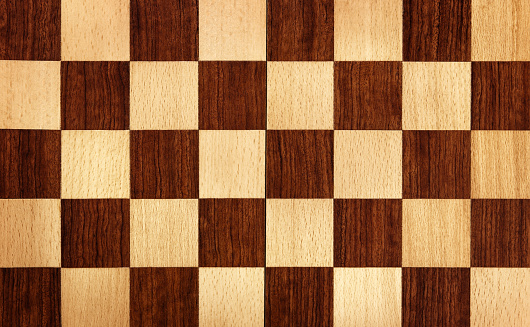 background image of a wooden chess board without any pieces on it