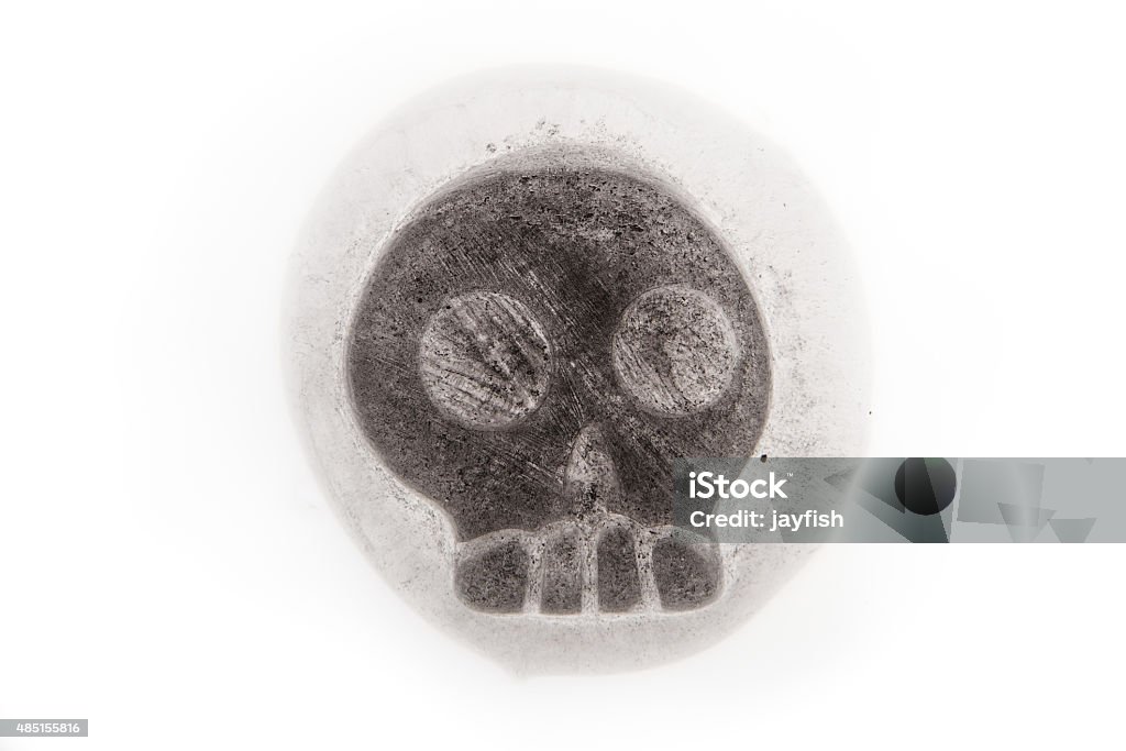 Iced skull Ice Cube in the shape of a human skull melting on a white background 2015 Stock Photo