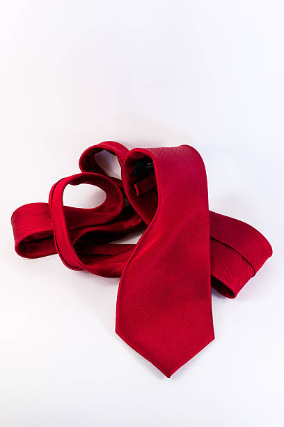 istock Crumpled Red Silk Tie on White Vertical Background 485158048