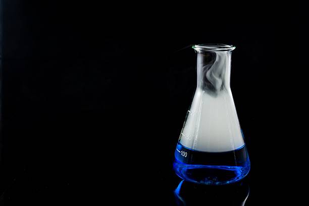 Laboratory glassware with molecular models and chemical bonds.