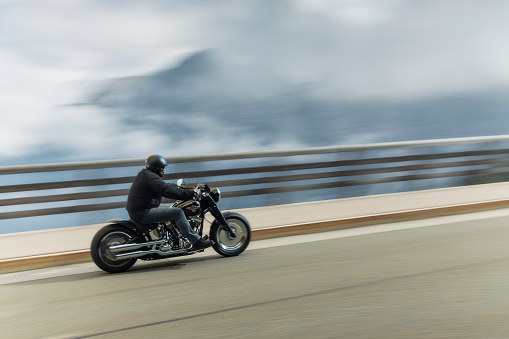 Berchtesgaden, Germany - August 21, 2015: Biker on his Harley Davidson is driving in Alps. 