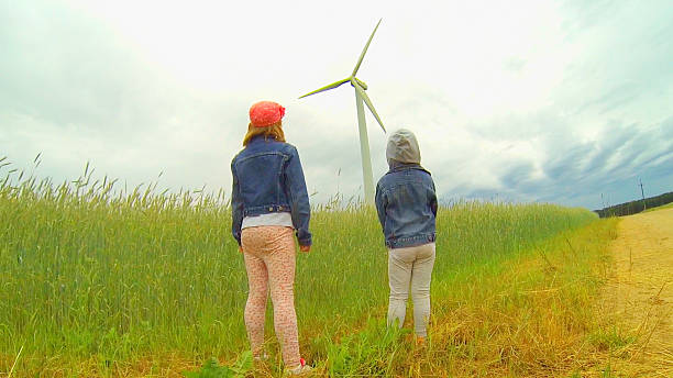 istock two girls looking at windmill 485160890