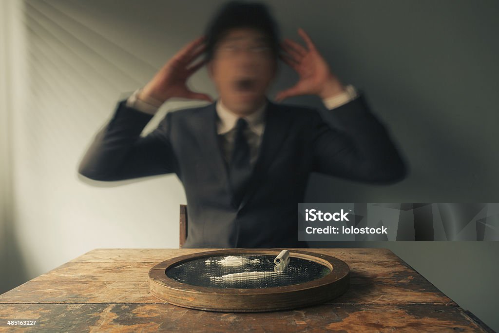 Businessman high on cocaine Young businessman is shaking after getting high on cocaine Cocaine Stock Photo