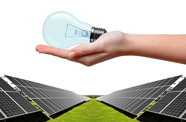 istock Solar energy panels and bulb in hand 485163709
