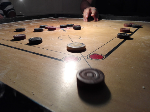Carrom is most easily described as \