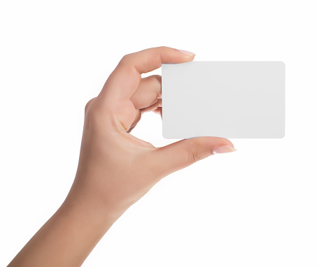 Blanc play card in woman hand on white.Isolated on whiteBusiness card in woman hand on white backround