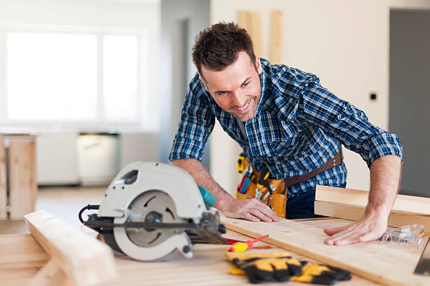 istock Smiling carpenter checking result of his work 485163923