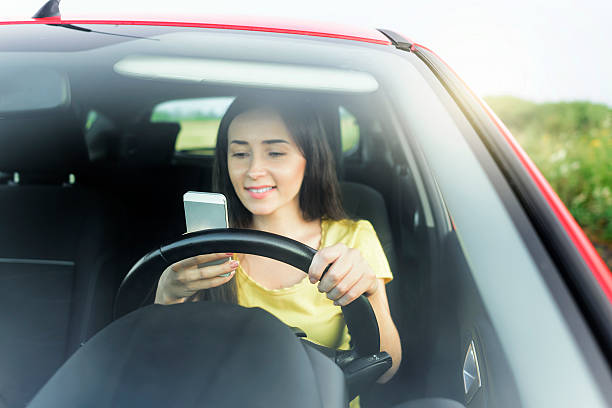 istock Woman using phone at the car 485164142