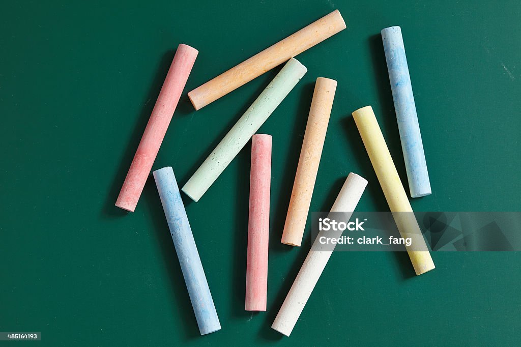 Colored chalk on a blackboard background Art Stock Photo