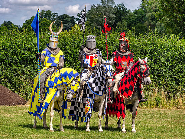Three knights are ready for tournament re-enactment Hever, United Kingdom - July 28, 2013: Three knights are ready for tournament re-enactment at jousting event close to Hever Castle in Kent, England  Hever Castle stock pictures, royalty-free photos & images