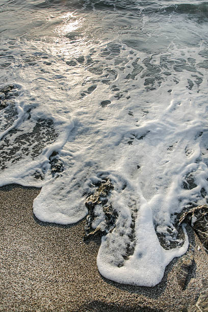 istock Part of a sea wave, on sand. 485164759