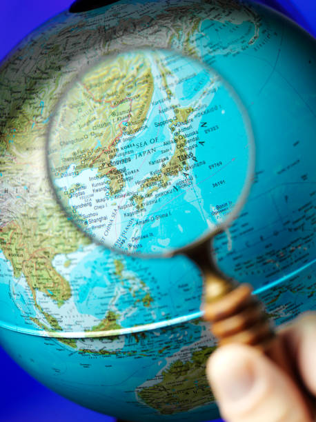 istock Looking at Japan through a Magnifying Glass on a Globe 485165089