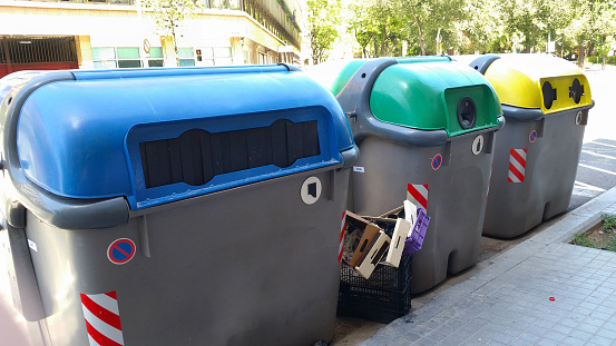 Big Recycling bins for waste paper and used glass bottles in Barcelona, Spain